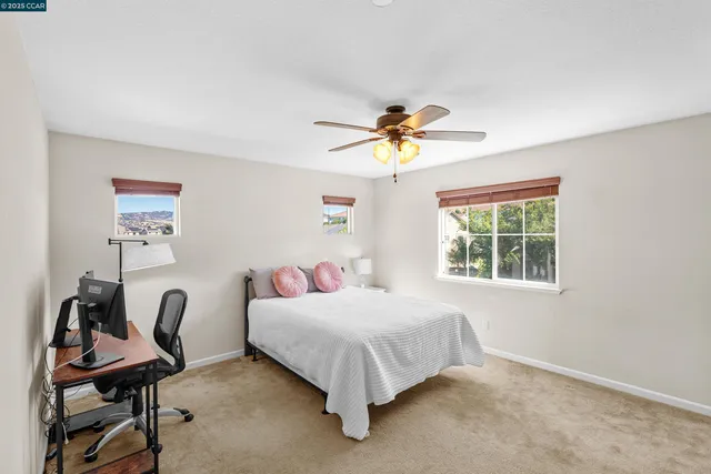 a bed room with a bed and a desk