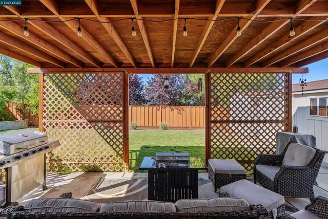 a outdoor space with patio furniture and a grill