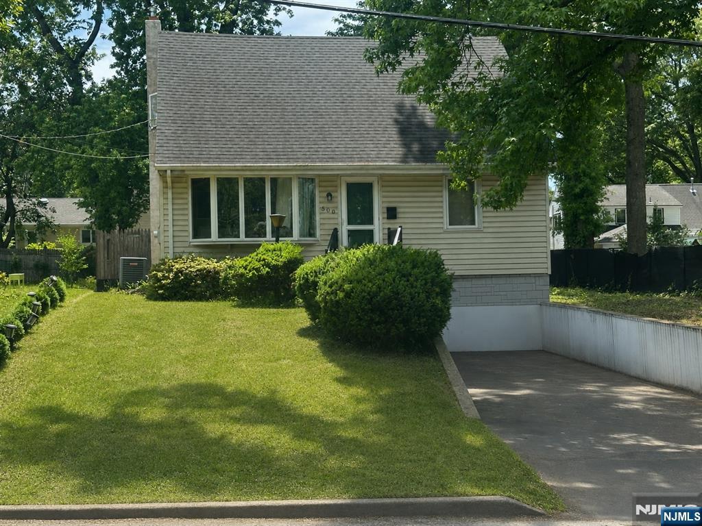 500 New Bridge Road Bergenfield, NJ 07621 - Photo 1 of 10 a view of an house with backyard space and garden