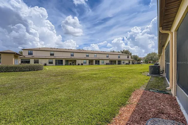 a view of a house with a big yard