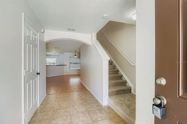 a view of a hallway view with staircase