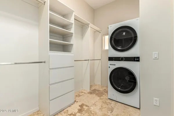 a view of a storage & utility room with washer and dryer