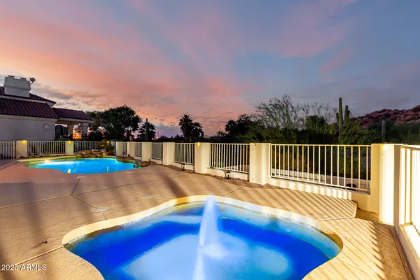 a view of a swimming pool with a lounge chairs