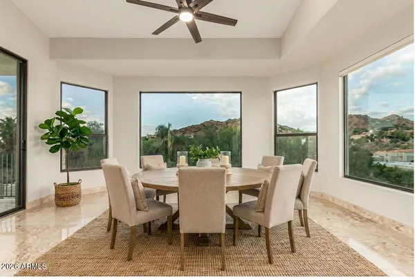 a view of a dining room with furniture window and outside view