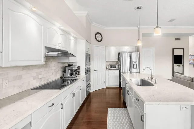 a living room with a floor to ceiling window and furniture