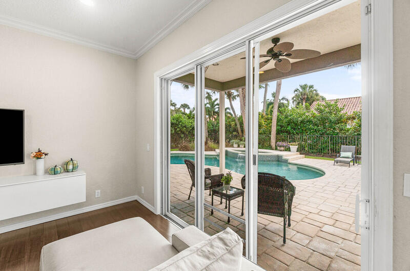 2620 Windham Court Delray Beach, FL 33445 - Photo 17 of 58 a living room with a floor to ceiling window and furniture