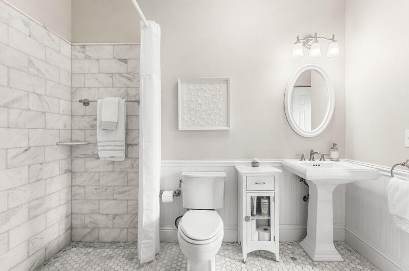 2620 Windham Court Delray Beach, FL 33445 - Photo 19 of 58 a bathroom with a toilet sink and mirror