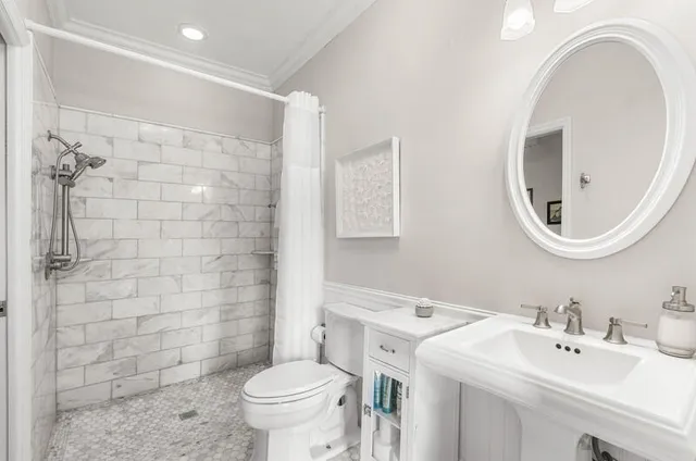 a bedroom with a large bed and a couch