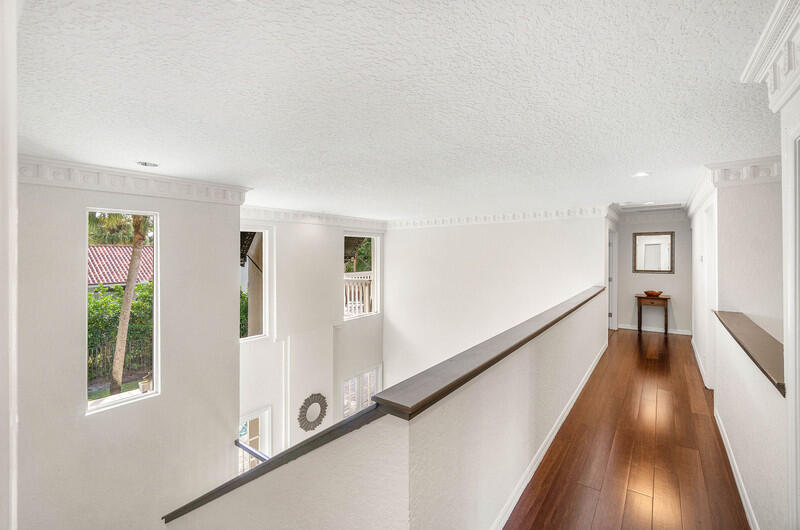 2620 Windham Court Delray Beach, FL 33445 - Photo 21 of 58 a view of a hallway with wooden floor and staircase