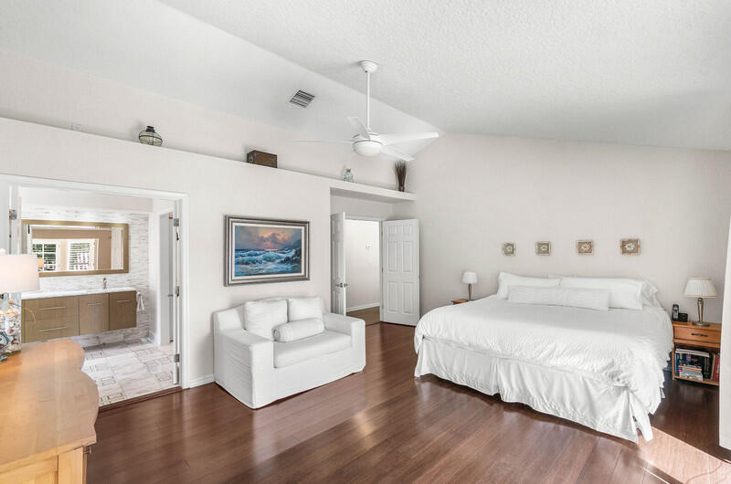 2620 Windham Court Delray Beach, FL 33445 - Photo 22 of 58 a bedroom with a large bed and a couch