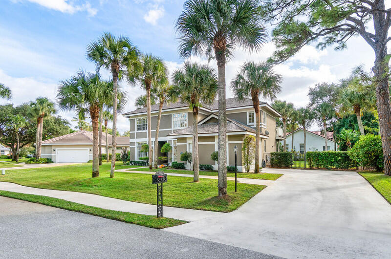 2620 Windham Court Delray Beach, FL 33445 - Photo 3 of 58 a view of a house with a yard and palm trees