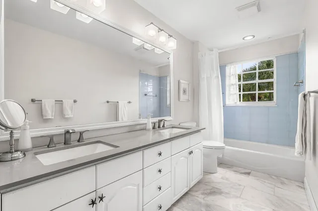 a view of a chair and tables in the patio of a house
