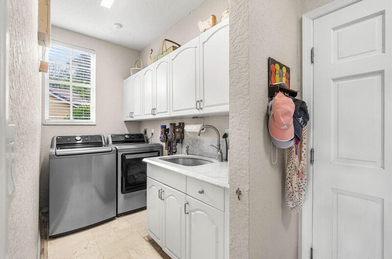2620 Windham Court Delray Beach, FL 33445 - Photo 33 of 58 a kitchen with stainless steel appliances granite countertop a sink and a stove top oven