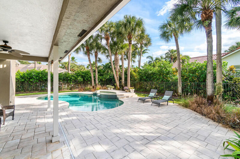 2620 Windham Court Delray Beach, FL 33445 - Photo 37 of 58 a view of swimming pool with lawn chairs and plants