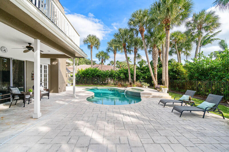 2620 Windham Court Delray Beach, FL 33445 - Photo 38 of 58 a view of a swimming pool with chairs in patio
