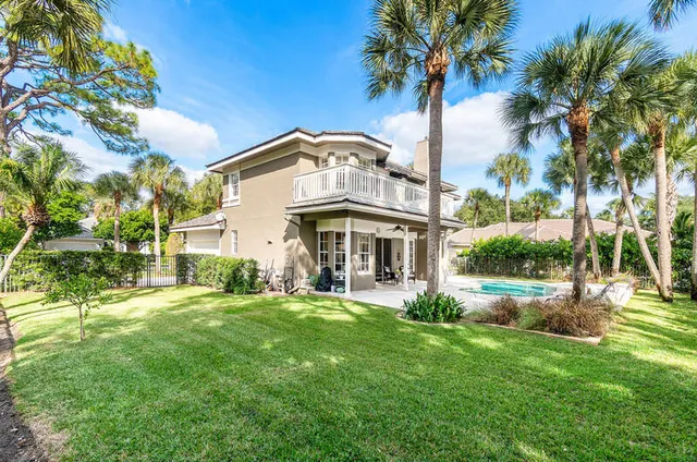 a backyard of a house with lots of green space