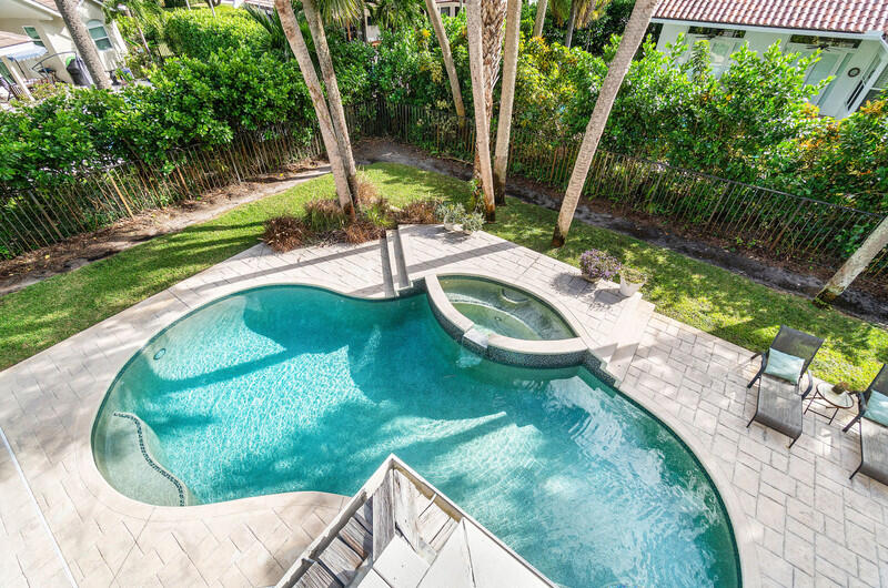 2620 Windham Court Delray Beach, FL 33445 - Photo 42 of 58 a view of a swimming pool with a yard and seating area