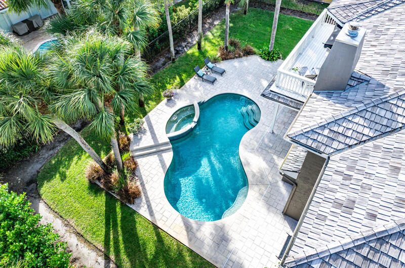 2620 Windham Court Delray Beach, FL 33445 - Photo 45 of 58 a view of a swimming pool with a patio