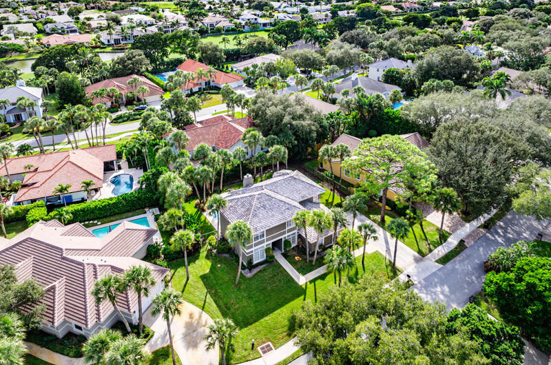 2620 Windham Court Delray Beach, FL 33445 - Photo 51 of 58 an aerial view of residential houses with outdoor space and trees all around