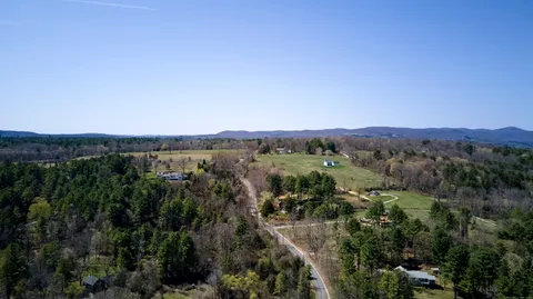 an aerial view of mountain with trees