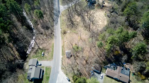 an aerial view of houses with yard
