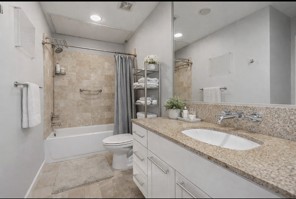 1600 Barton Springs Road, Unit 2302 Austin, TX 78704 - Photo 3 of 12 Bathroom featuring vanity, shower / bath combo, and recessed lighting