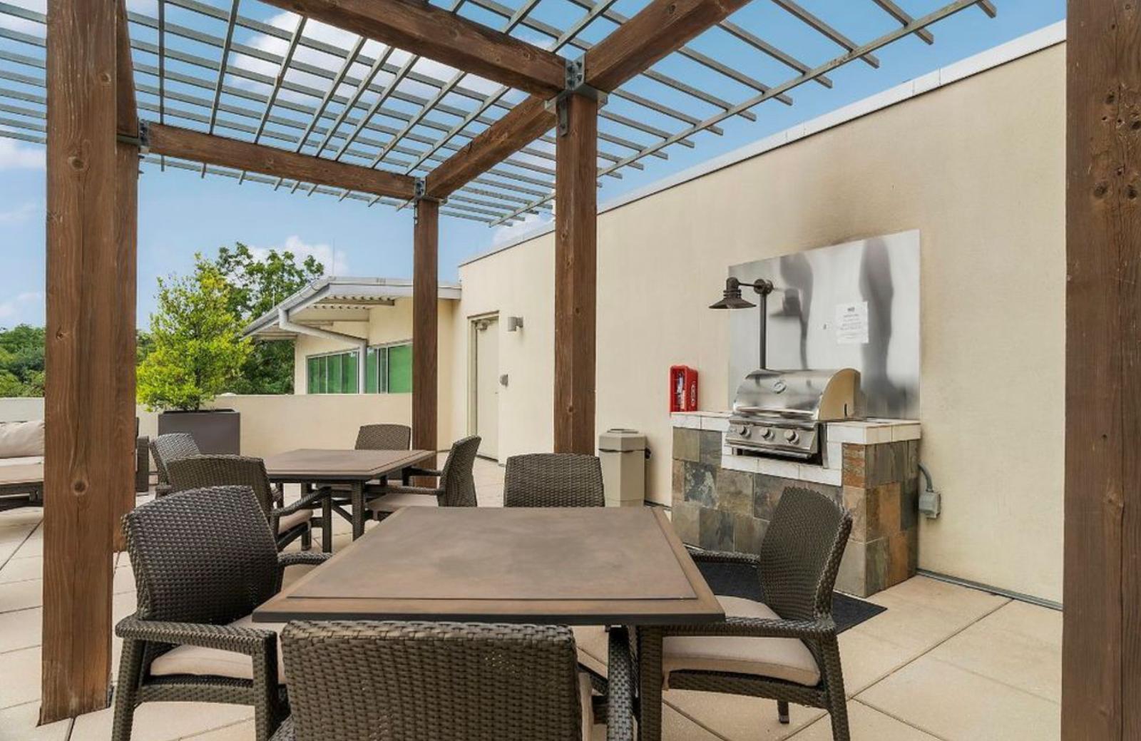 1600 Barton Springs Road, Unit 2302 Austin, TX 78704 - Photo 8 of 12 View of patio / terrace featuring an outdoor kitchen / dining area and a pergola