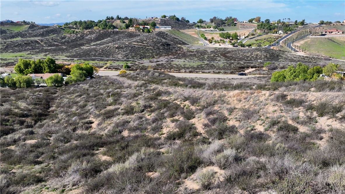 42160 Anza Road Temecula, CA 92592 - Photo 12 of 13 a view of a dry yard with trees and houses