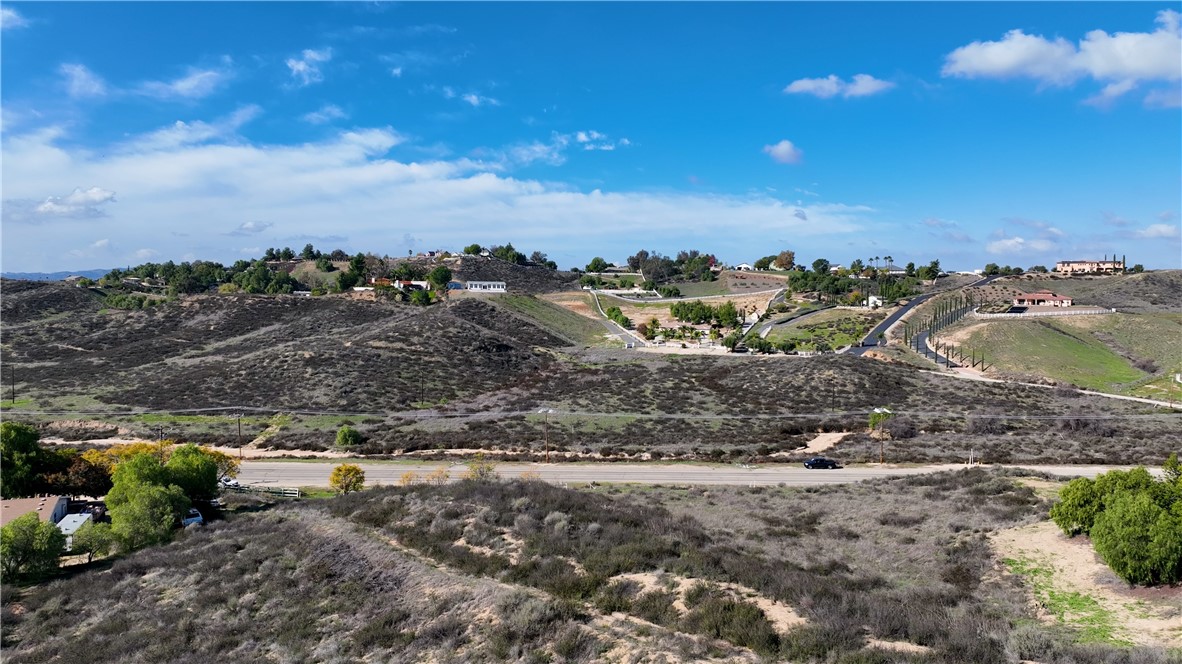 42160 Anza Road Temecula, CA 92592 - Photo 4 of 13 a view of a dry yard with wooden fence