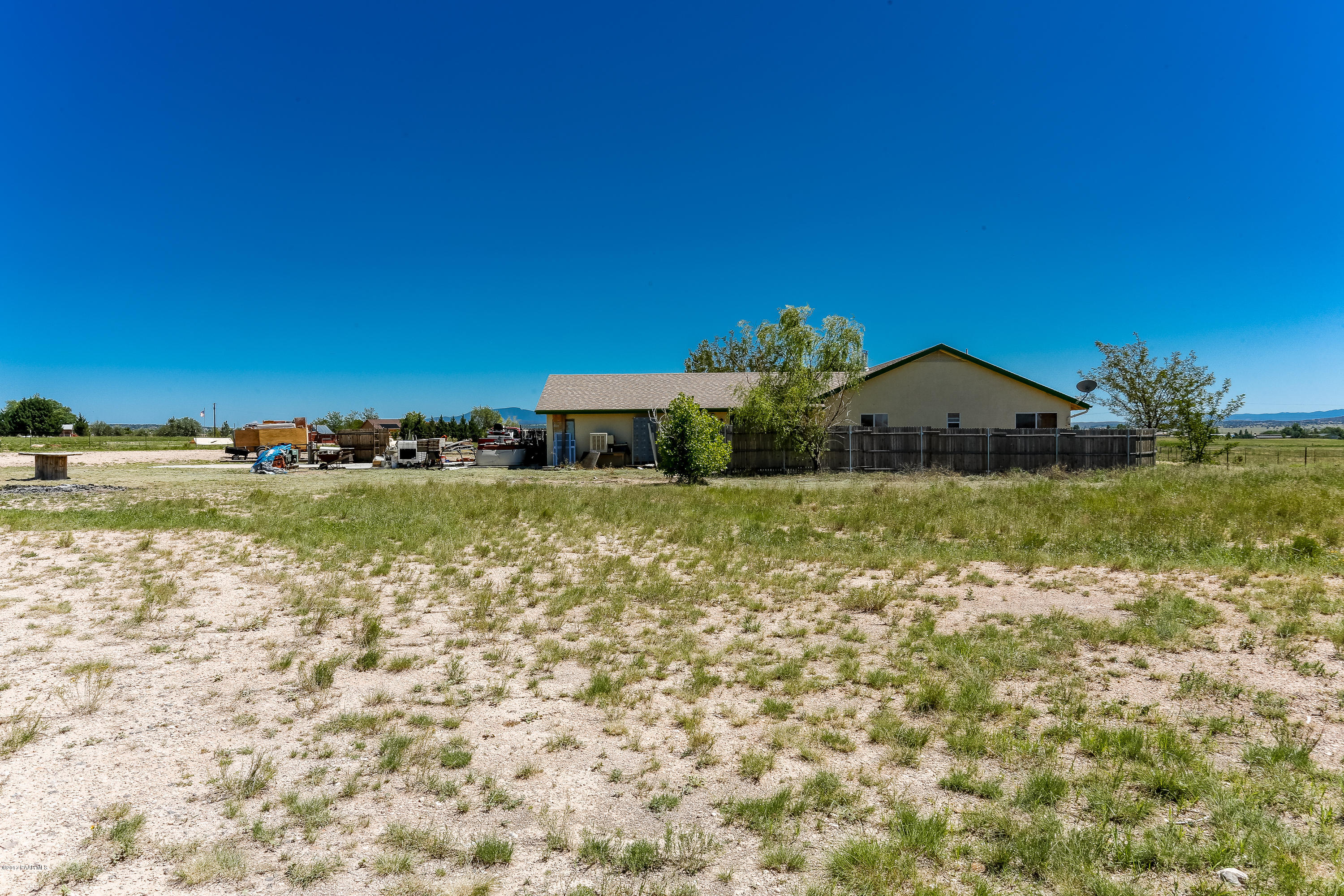 1900 West Big Sky Ranch Road Paulden, AZ 86334 - Photo 1 of 39 a view of a yard with an outdoor space