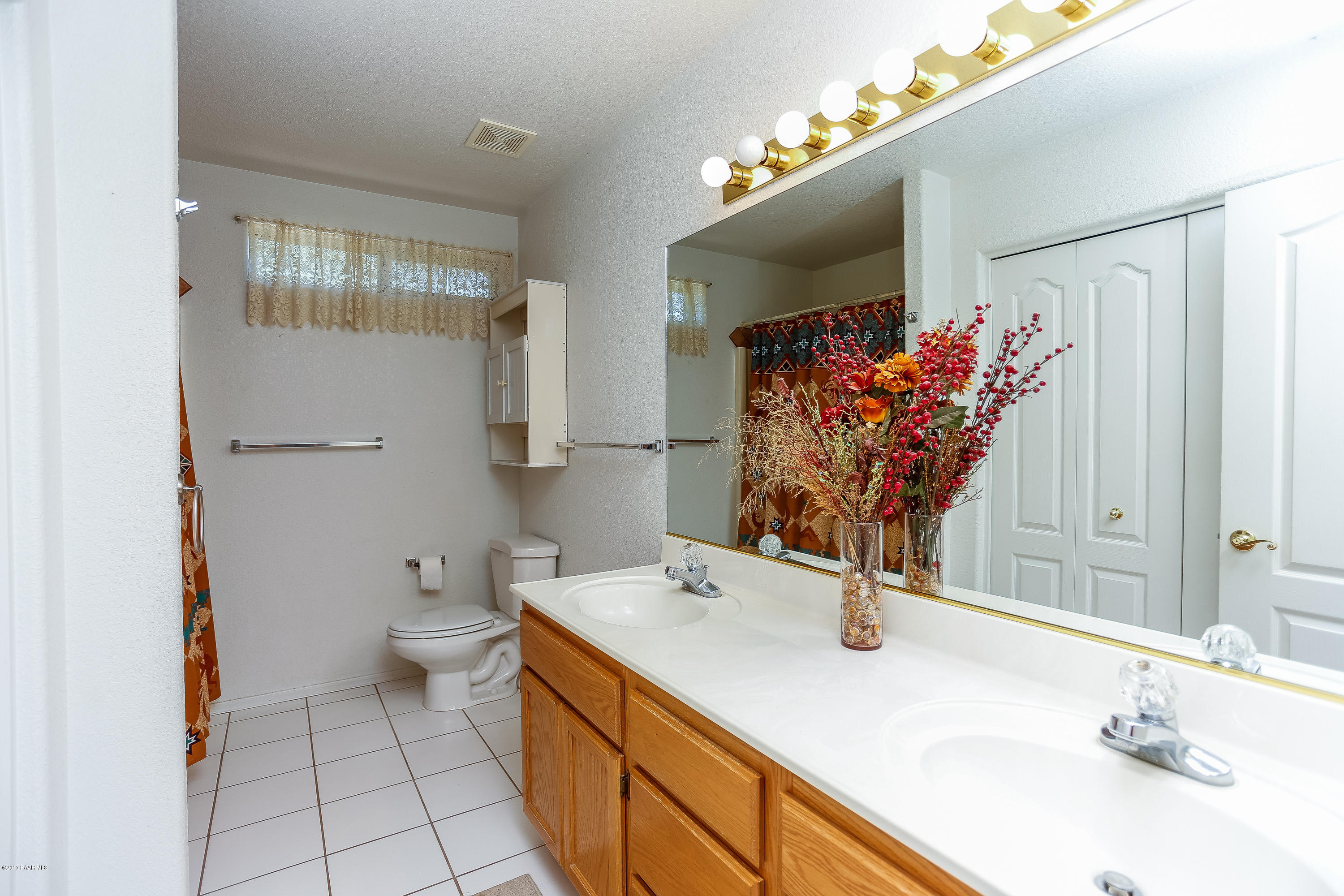 1900 West Big Sky Ranch Road Paulden, AZ 86334 - Photo 11 of 39 a bathroom with a sink and a mirror