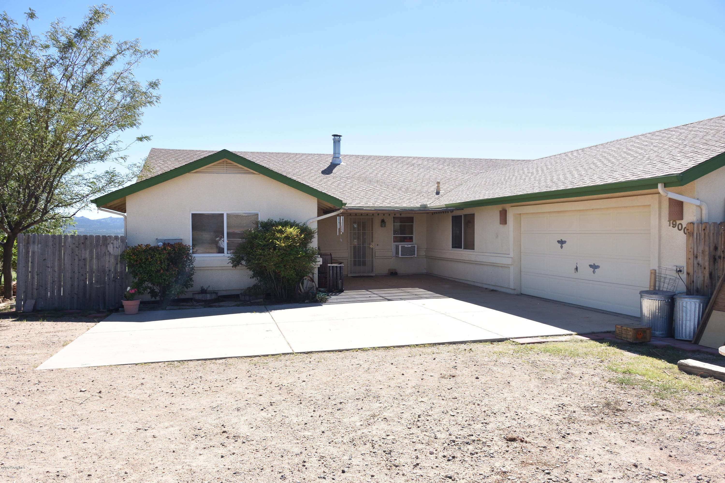 1900 West Big Sky Ranch Road Paulden, AZ 86334 - Photo 2 of 39 a front view of a house with a yard