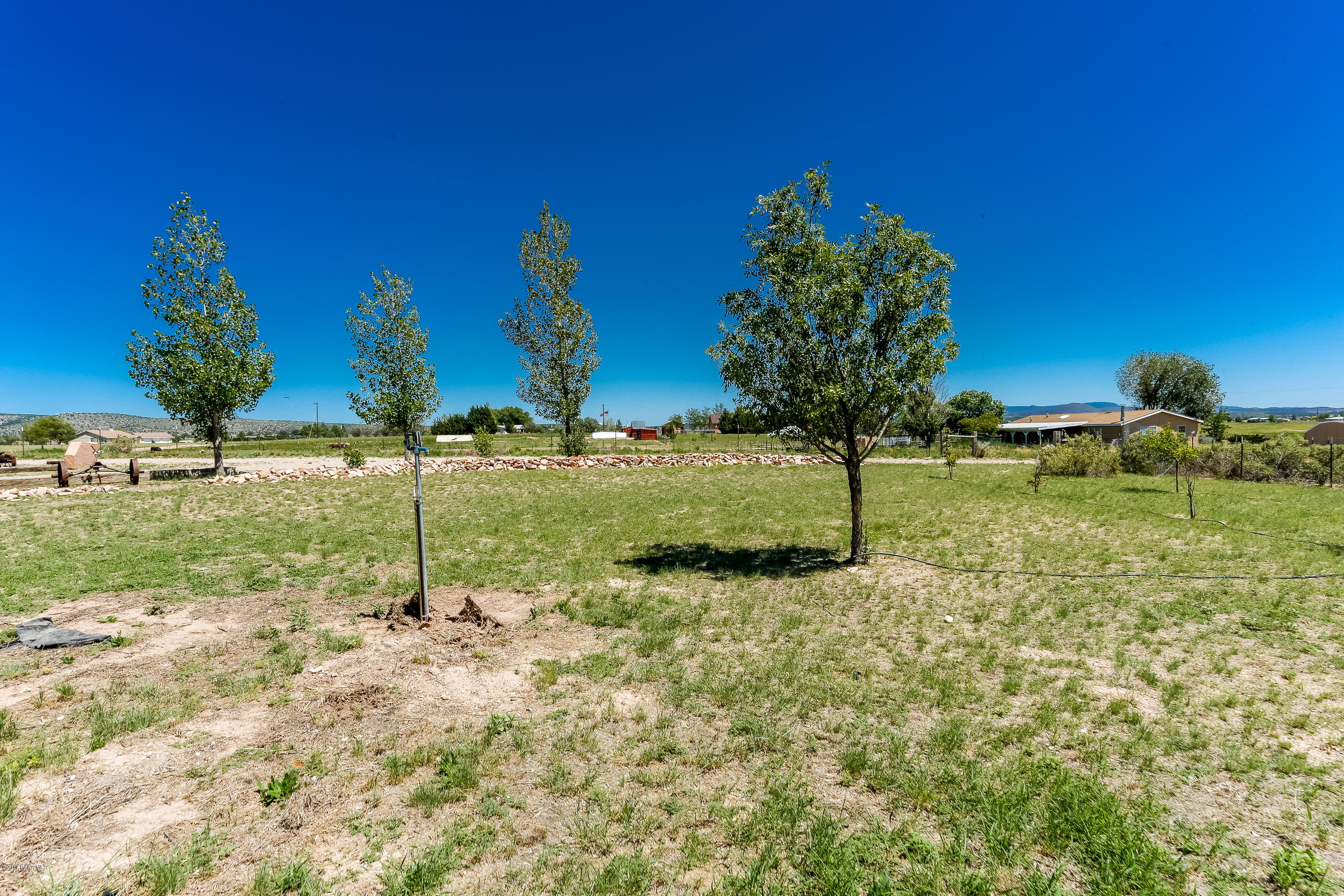 1900 West Big Sky Ranch Road Paulden, AZ 86334 - Photo 29 of 39 a backyard of a house with lots of green space
