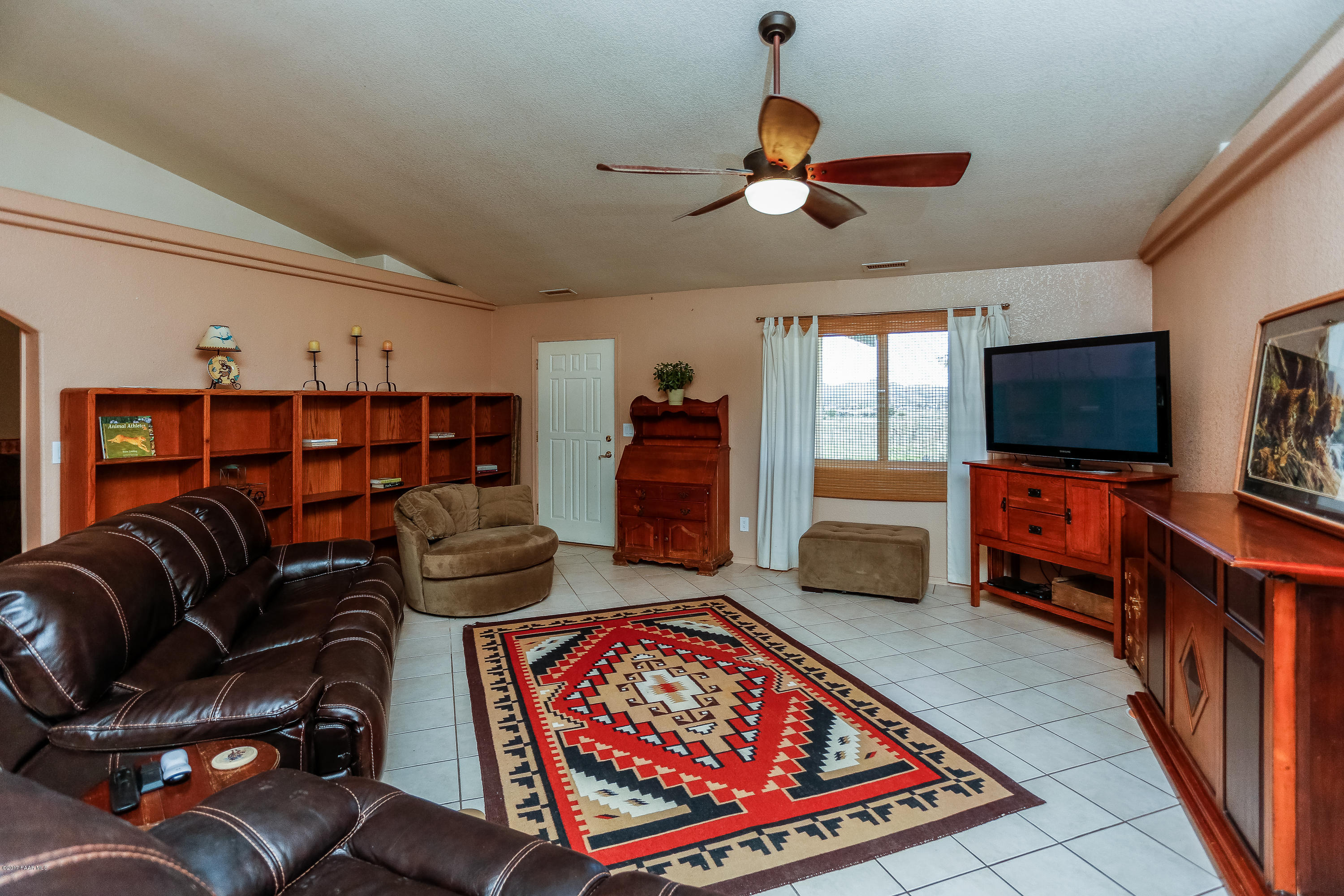 1900 West Big Sky Ranch Road Paulden, AZ 86334 - Photo 3 of 39 a living room with furniture and a flat screen tv