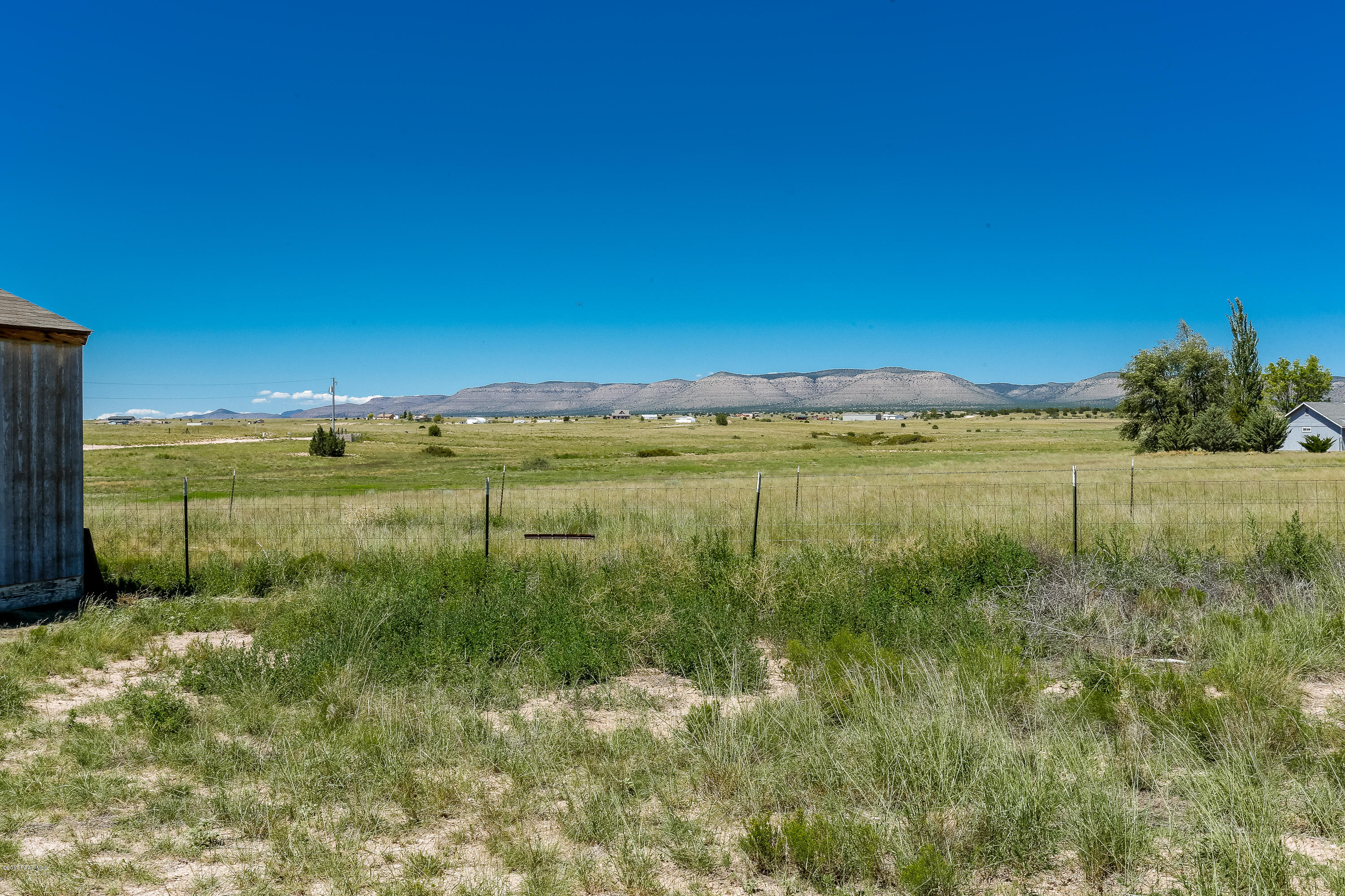 1900 West Big Sky Ranch Road Paulden, AZ 86334 - Photo 34 of 39 a view of a lake with a yard