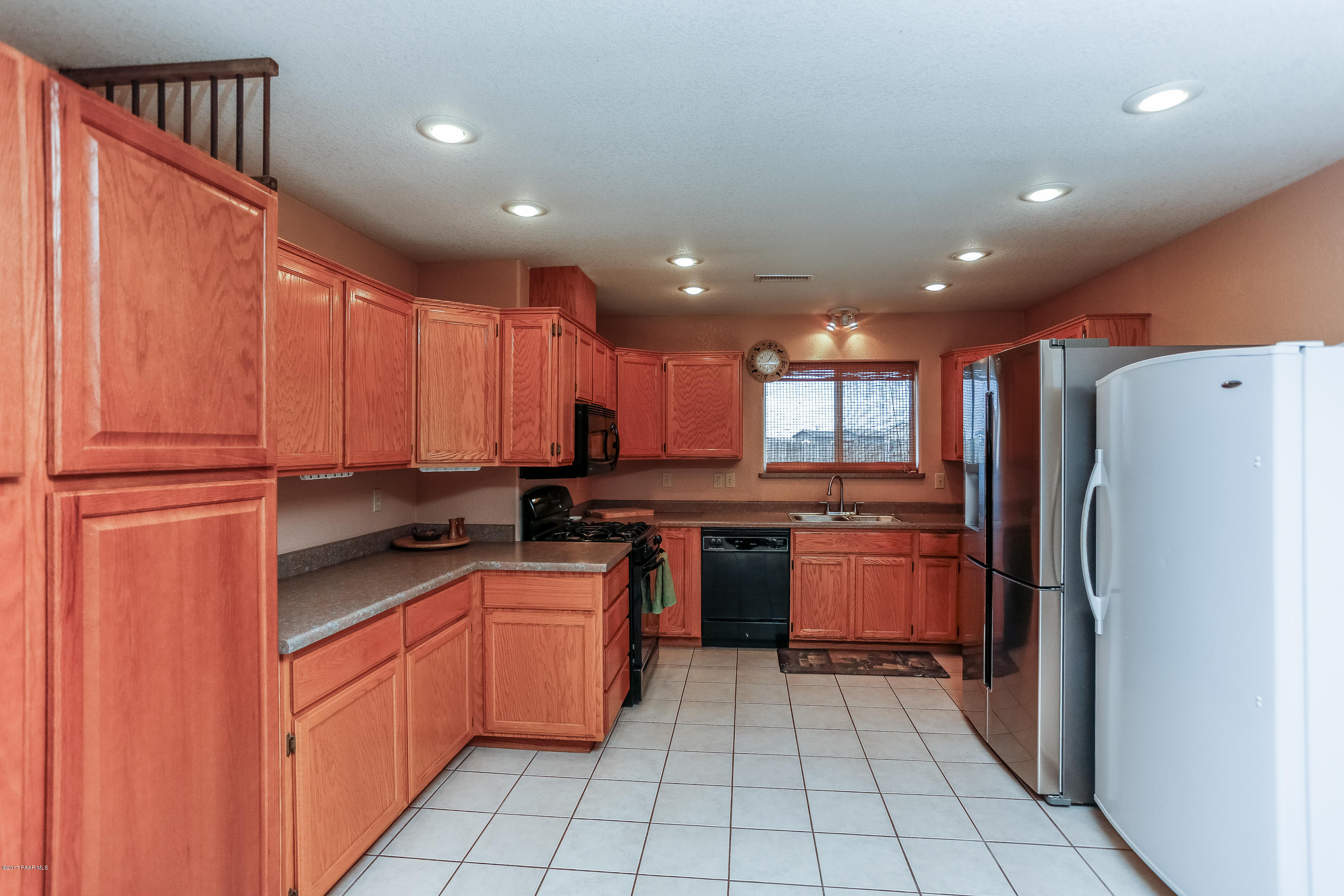 1900 West Big Sky Ranch Road Paulden, AZ 86334 - Photo 5 of 39 a kitchen with stainless steel appliances granite countertop a refrigerator and a sink