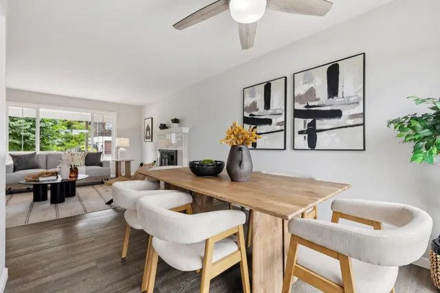 a dining room with furniture and window