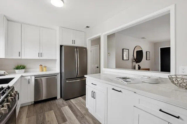 a kitchen with a sink and cabinets
