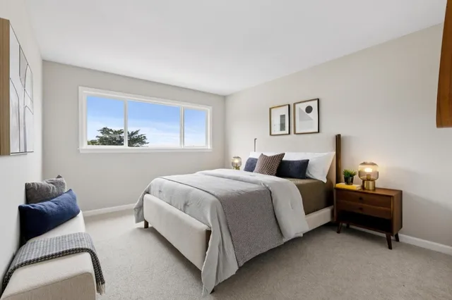 a bedroom with a bed and window