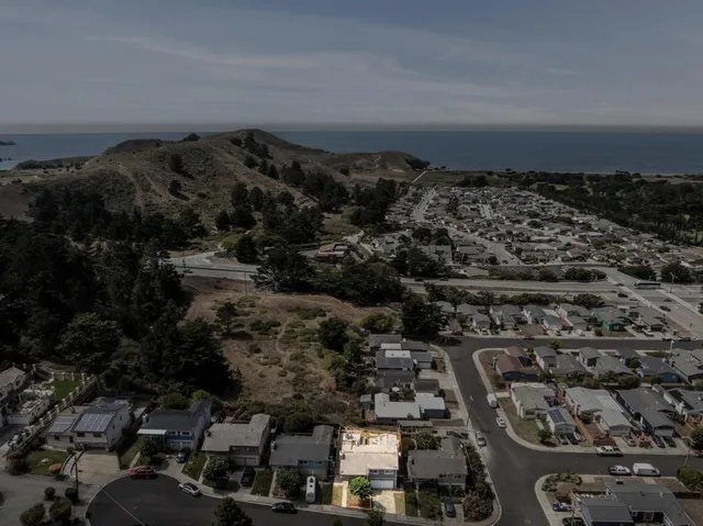 an aerial view of a city with lots of residential buildings