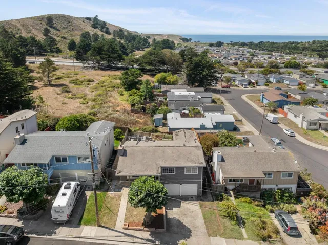 an aerial view of a house with a garden