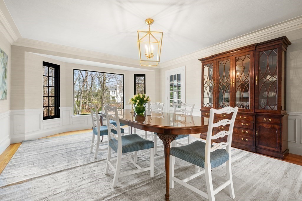 77 Woodcliff Road Wellesley, MA 02481 - Photo 12 of 42 a dining room with furniture a chandelier and wooden floor