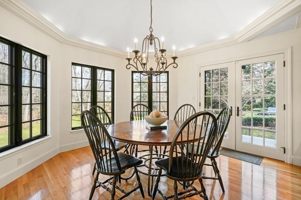 77 Woodcliff Road Wellesley, MA 02481 - Photo 21 of 42 a dining room with furniture a chandelier and wooden floor