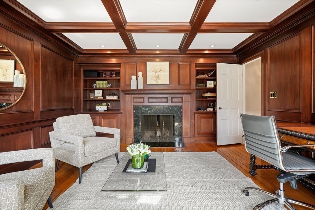 77 Woodcliff Road Wellesley, MA 02481 - Photo 24 of 42 a living room with furniture a fireplace and a table