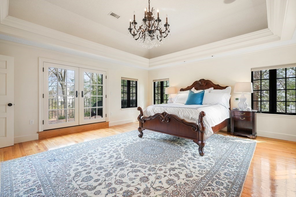 77 Woodcliff Road Wellesley, MA 02481 - Photo 26 of 42 a bedroom with a large bed and a window