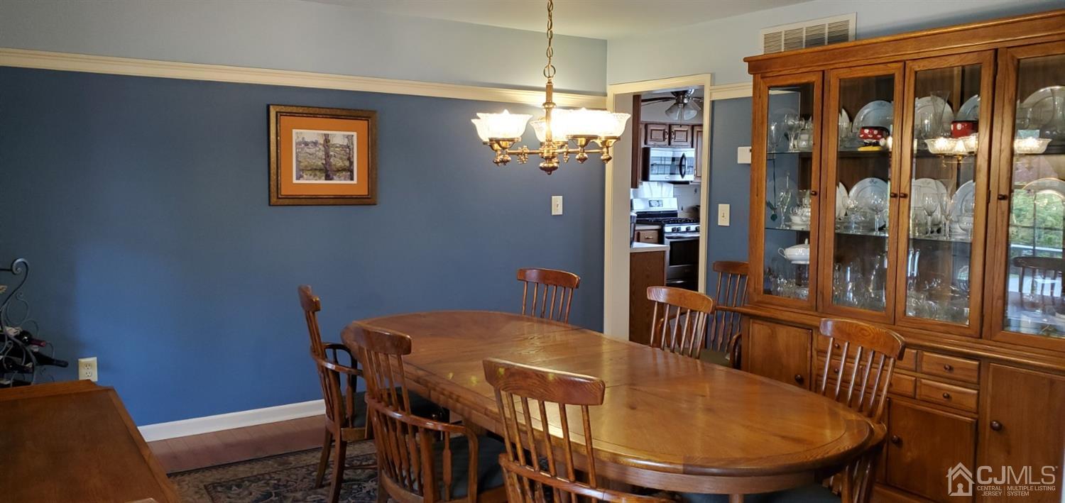 3 Interlaken Road Monmouth Junction, NJ 08852 - Photo 1 of 21 a view of a dining room with furniture window and wooden floor