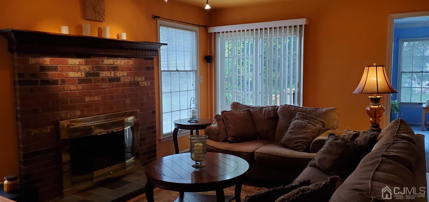3 Interlaken Road Monmouth Junction, NJ 08852 - Photo 14 of 21 a living room with furniture a window and a fireplace