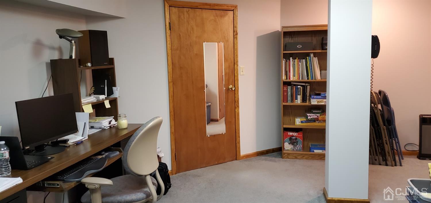 3 Interlaken Road Monmouth Junction, NJ 08852 - Photo 20 of 21 a view of a workspace with furniture and a window