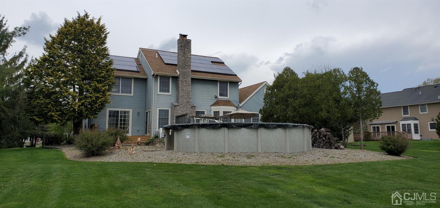 3 Interlaken Road Monmouth Junction, NJ 08852 - Photo 7 of 21 a front view of a house with a garden and a tree