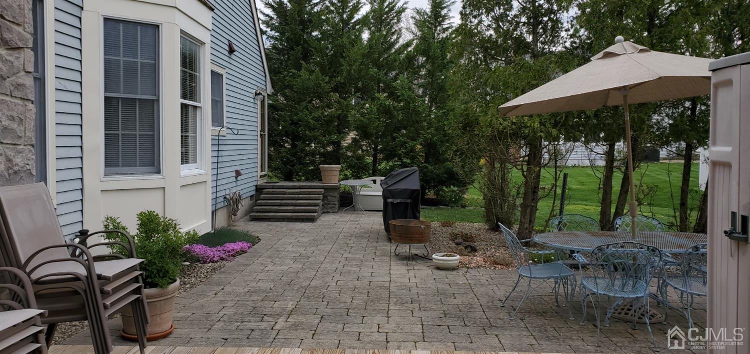 3 Interlaken Road Monmouth Junction, NJ 08852 - Photo 9 of 21 a view of a chairs and table in backyard of the house